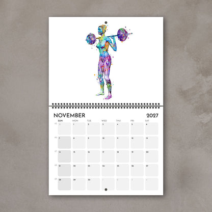 2027 medical wall calendar November page showing body muscles in weightlifting, sports watercolor poster
