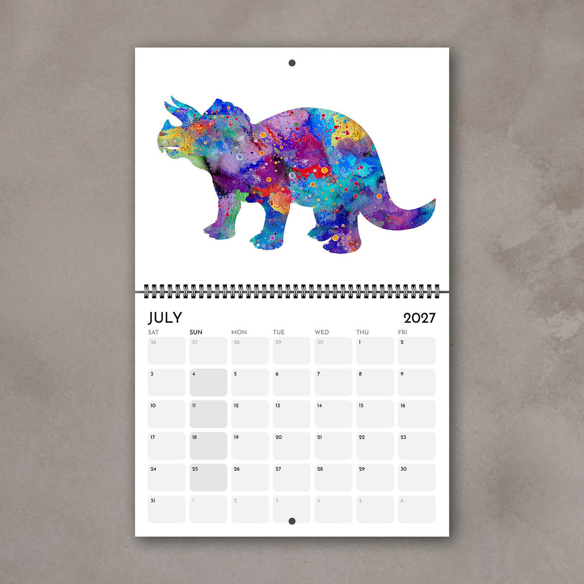 July 2027 watercolor wall calendar page with multicolor dinosaur art for a child’s room
