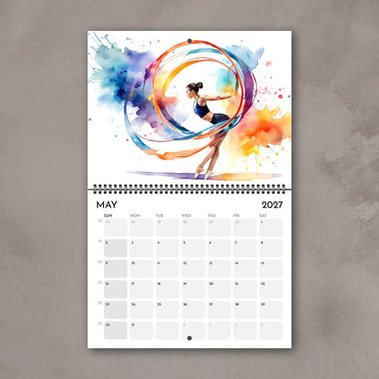 2027 Girls sports watercolor wall art calendar May page with gymnastics girl artwork in bright multicolor tones
