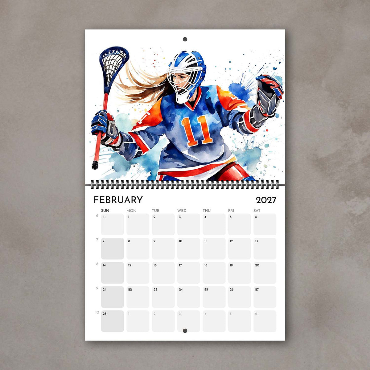 2027 Girls sports watercolor wall art calendar February page with lacrosse goalie girl artwork in bright colors
