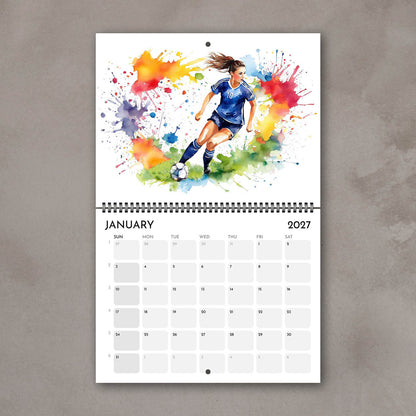 2027 Girls sports watercolor wall art calendar January page, soccer girl illustration with bright multicolored splashes
