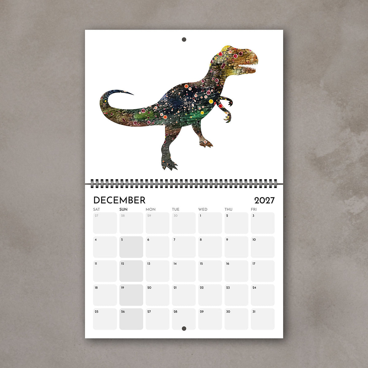 December 2027 dinosaur calendar page with prehistoric animal artwork for a kids’ room