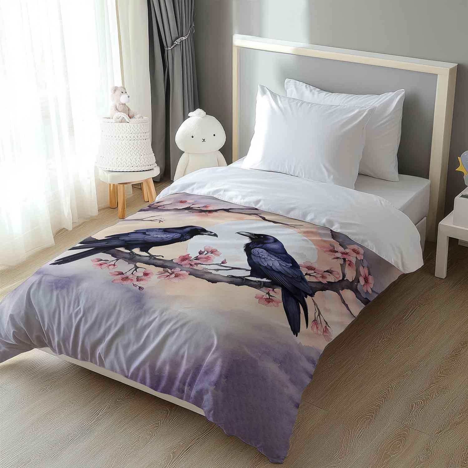 Raven cherry blossom duvet cover on twin bed, gothic bird art print bedding for dark aesthetic room