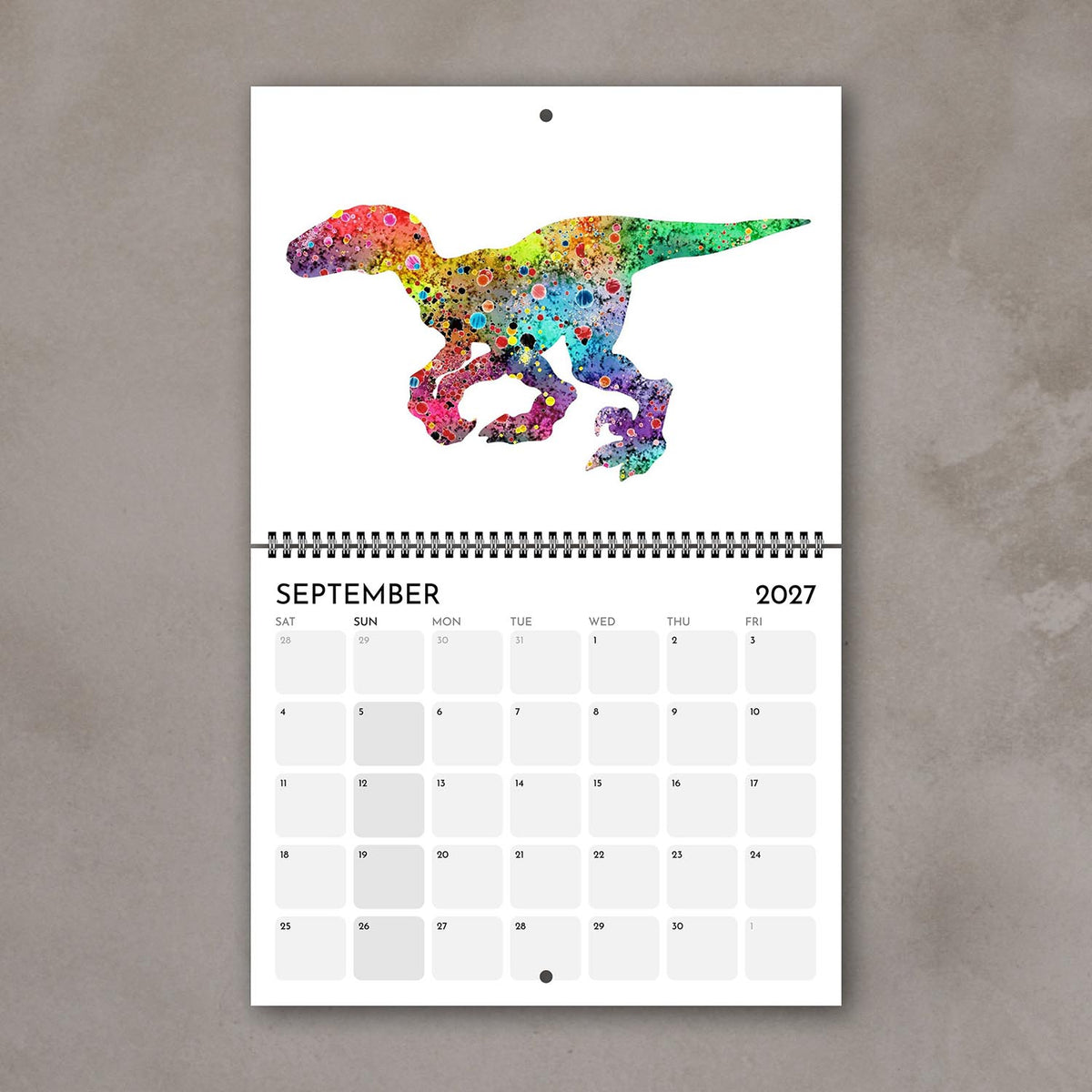 September 2027 kids’ calendar page with a dinosaur in bright multicolor watercolor tones