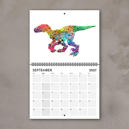 September 2027 kids’ calendar page with a dinosaur in bright multicolor watercolor tones